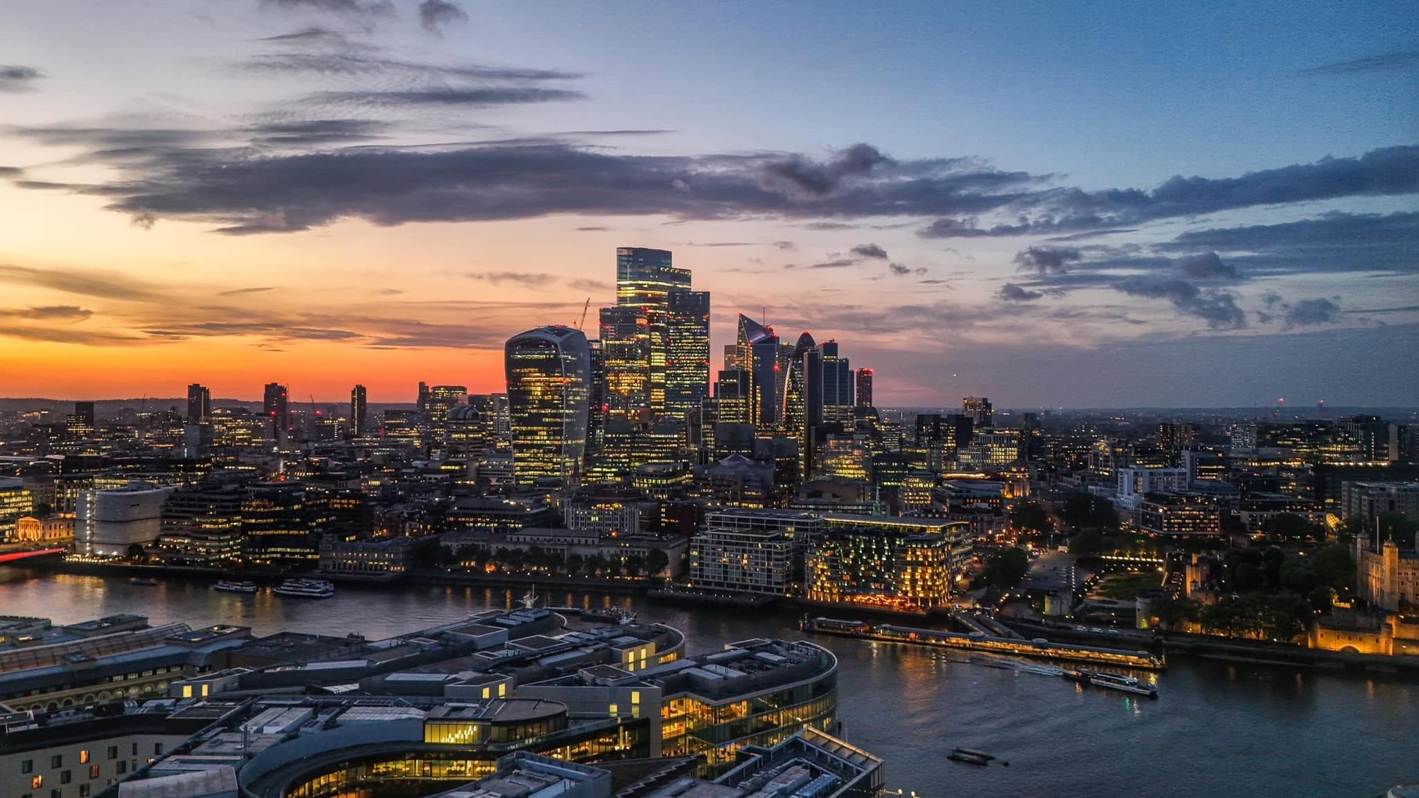 Sweeping aerial drone view across a city skyline