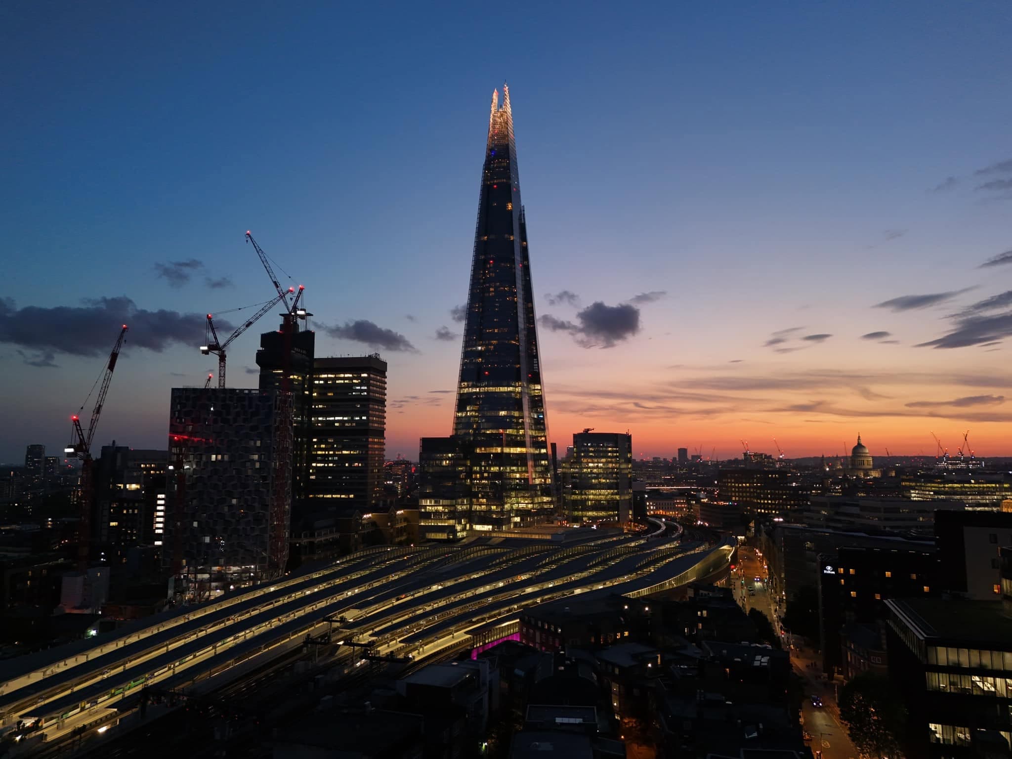 Aerial drone photograph looking down over city rooftops