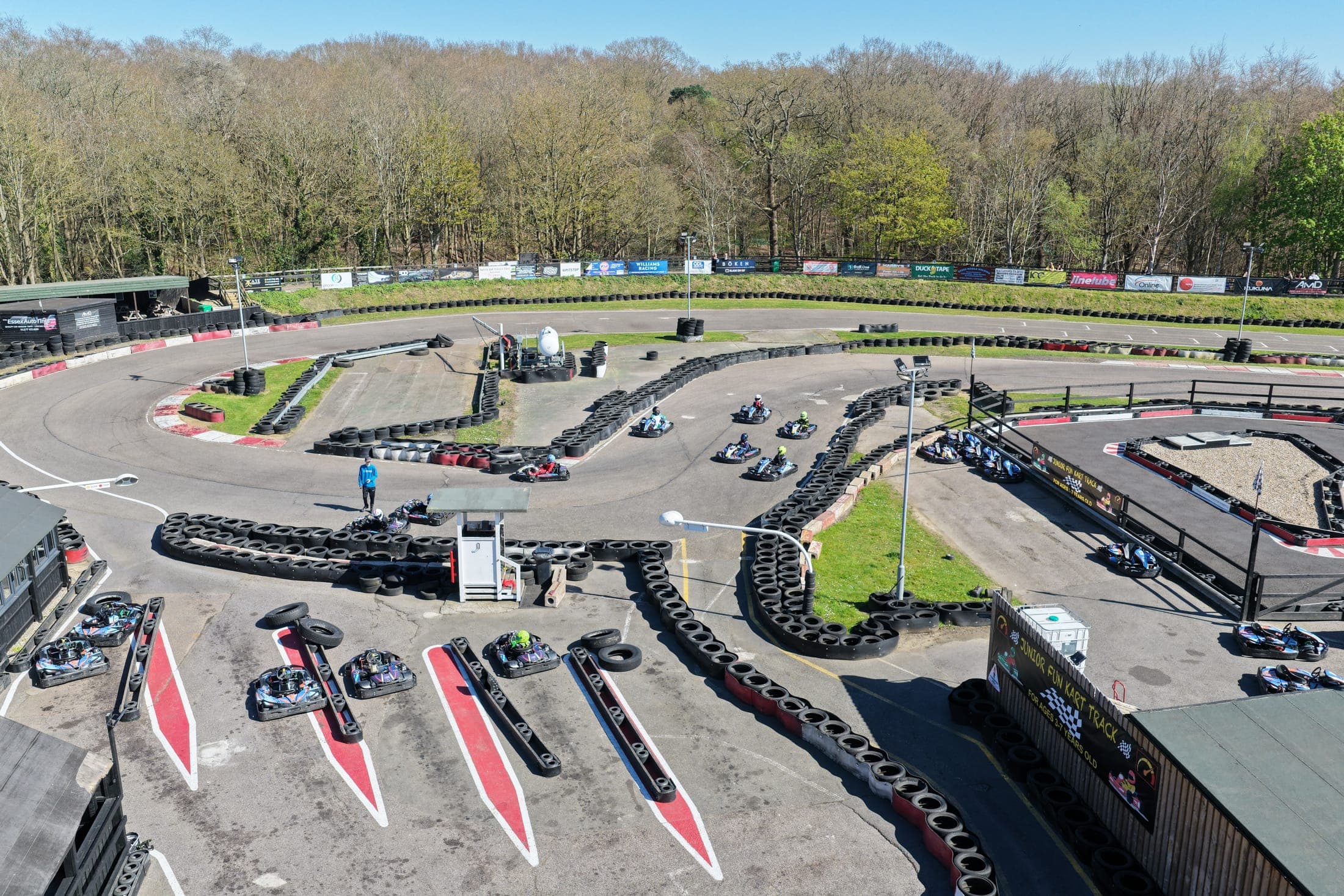 Karts rounding a bend during an active session at Brentwood Karting